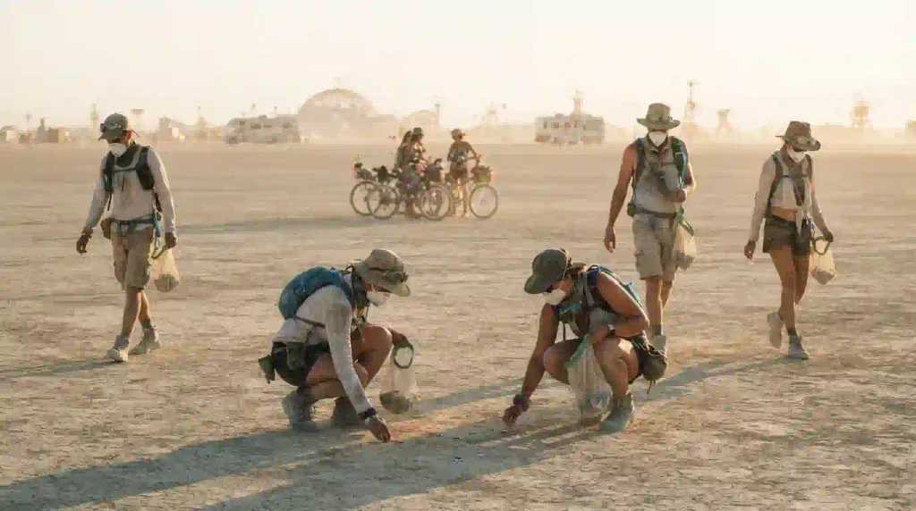 Burning Man participants collecting MOOP and protecting the Black Rock Desert playa